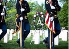 A wreath is placed at the grave of Army Private William Christman, the first person laid to rest at Arlington National Cemetery. Image source: www.dcmilitary.com